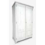 A modern pine white painted twin door wardrobe, 140 by 60 by 195cm high.