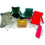 A collection of four folding garden chairs and various garden sporting equipment, including