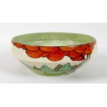 A Clarice Cliff float bowl, circa 1937, decorated in the Limberlost pattern, externally with trees