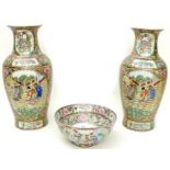 A pair of 20th century Chinese Canton porcelain baluster vases, typically decorated with reserves of