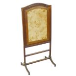 A 19th century fire screen, with mahogany reeded frame inset with a cream and gold embroidered