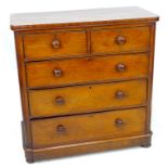 A late Victorian mahogany chest, of two short over three long drawers, with turned handles, 105 by