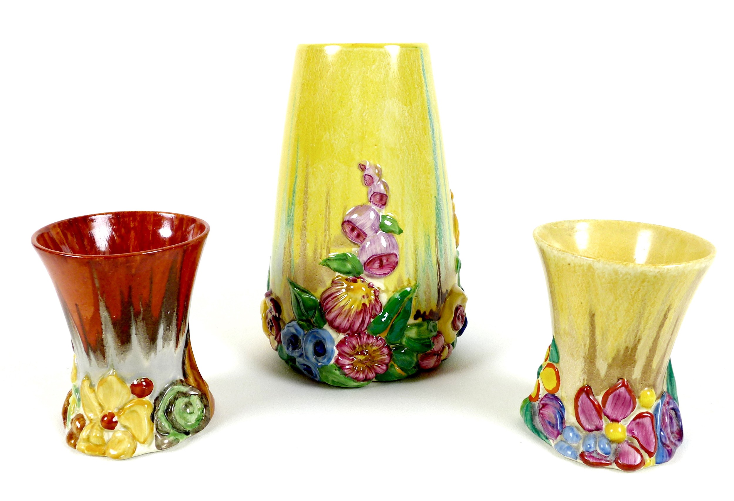 A pair of Clarice Cliff vases in the My Garden pattern, of squat flared form, with moulded flowers