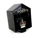 A modern post box, painted black, the front with 'Post' and a Royal crown, for wall mounting, 37