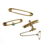 Two 9ct gold brooches, one in the form of a plane, with safety chain, back marked EJ and