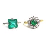 An 18ct gold ring, the flowerhead design inset with white stones surrounding green glass stone,