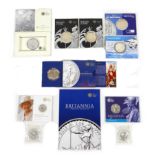 A collection of ten silver coins, comprising eight £2 Britannia silver bullion, four sealed