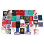 A collection of thirty-seven Royal Mint year part and complete sets,