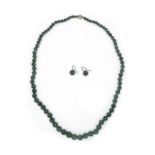 A vintage jade bead necklace, of seventy eight graduated beads, 57cm long, 40.8g, with twenty five