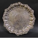 A Victorian silver card tray, with shell and scroll decorative rim, and floral decoration