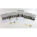 A collection of GB commemorative coins, comprising two cased Jubilee Mint three coins sets 'The 70th