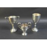 Three silver cups, comprising a George V Christening goblet, inscribed 'J.H.W. 24 Jan 1929', William
