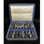 A cased set of eight possibly American silver teaspoons, with shell mounts, and engraved with '