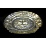 A 19th continental silver fruit dish of oval form, decorated with repousse fruit, stamped '800',