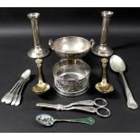 A collection of silver and plated items including a pair of silver candlesticks, modernist form with