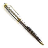 A Cartier ball point pen, ribbed body and blue plastic cabochon pommel, twist action, engraved