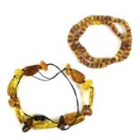 A vintage amber necklace of polished naturalistically shaped beads, ranging from butterscotch