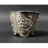 A late 19th century Chinese silver pot, the tapering quatrefoil body chased and embossed with