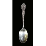 An ornate Edwardian silver table spoon, decorated with Irish clovers, a Scottish thistle and a Tudor