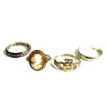 A group of 9ct gold rings, comprising a Claddagh ring, an unmarked cameo ring, and a white gold