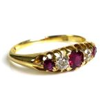 **PLEASE NOTE CHANGE TO DESCRIPTION** An 18ct gold diamond, ruby and purple stone ring,