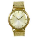 An Omega 9ct gold gentleman's wristwatch, circa 1970s, the circular silvered dial with baton hour