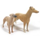 Two Beswick dog figurines, comprising 'Greyhound "Jovial Roger" ', model 972, light sandy brown -
