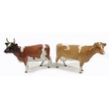 Two Beswick cows, comprising an 'Ayrshire Cow Ch. "Ickham Bessie"', model 1350, 12.7cm, and a '