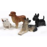 A group of four Beswick dogs, comprising 'Bulldog', model 1872, white, pale tan ear and around
