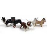 A group of five Beswick dogs, comprising a 'Sheepdog - Small', model 1854, black and white -