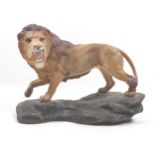 A Beswick 'Lion on Rock', model 2554A, golden brown, satin matt, 21cm high.