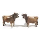 Two Beswick bulls, comprising a 'Jersey Bull Ch. "Dunsley Coy Boy" ', model 1422, light brown with