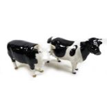 Two Beswick cows, comprising a 'Friesian Cow Ch. "Claybury Leegwater"', model 1362A, black and white