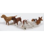 A group of five Beswick dogs, comprising 'Labrador - Small', model 1956, golden brown - gloss, 8.3cm