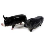 Two pig figurines, comprising a Beswick 'Berkshire Boar', model 4118, black and white - gloss with