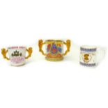 A group of three commemorative cups, comprising a Paragon limited edition loving cup, with lion