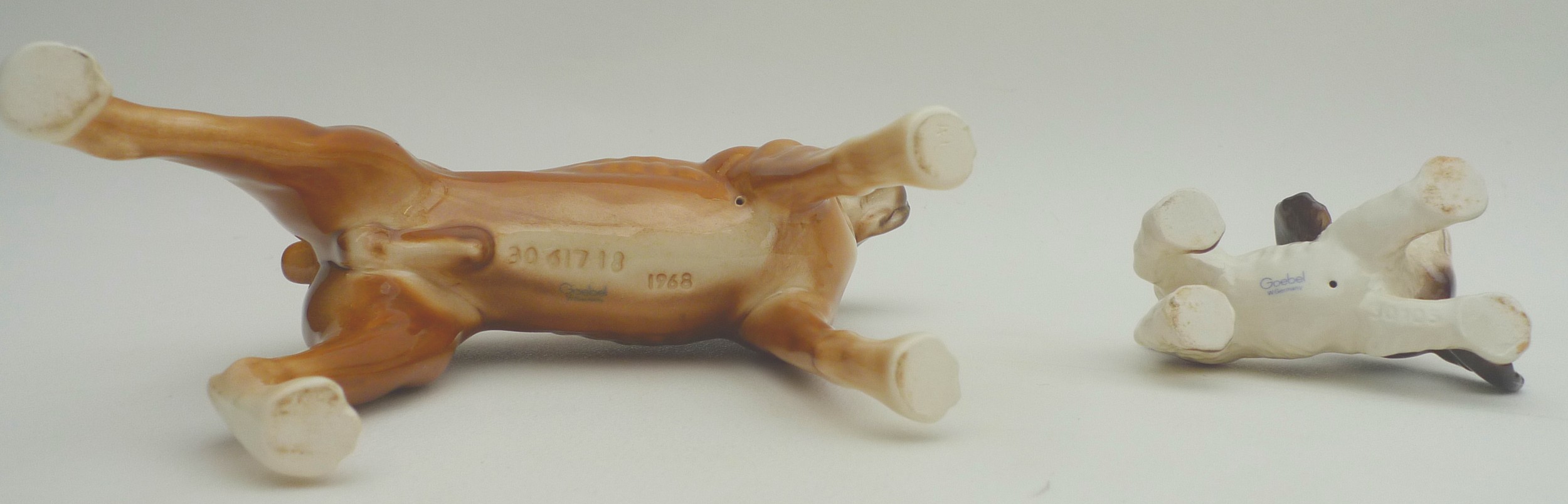 A collection of ceramic animal figurines, all modelled as dogs, some marked, including two Goebel, - Image 9 of 11