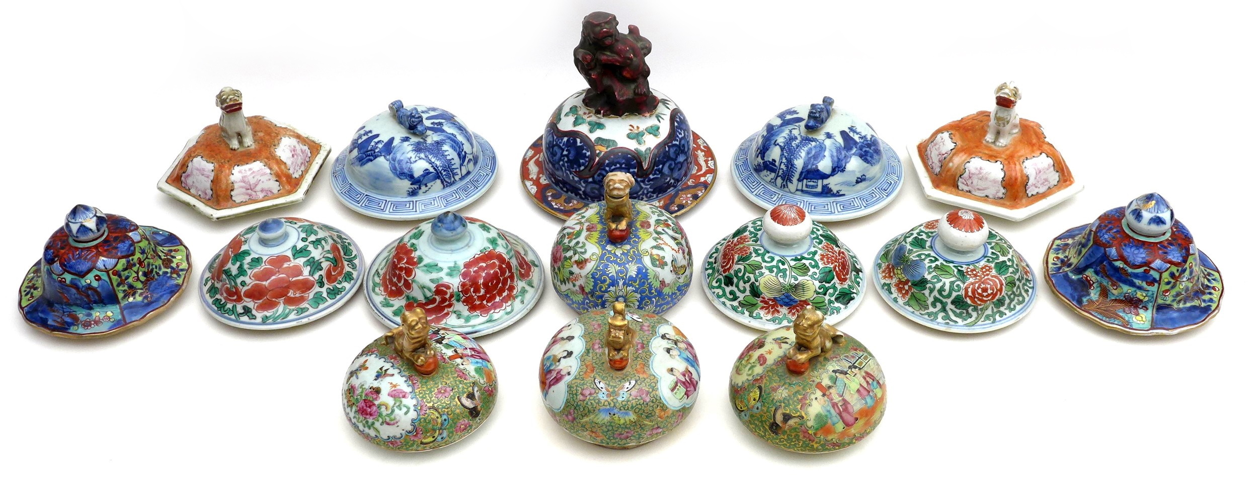 An unusual group of fifteen Chinese vase and jar covers, mostly 19th century, including Canton