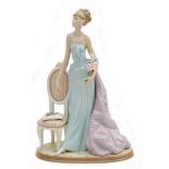 A Lladro figurine 'A Lady of taste' with maker's marks and impressed number '1495' to its base, 24
