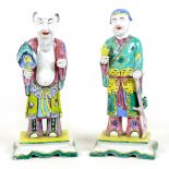 Two Chinese porcelain polychrome figures, likely early 20th century, each modelled as a deity, one