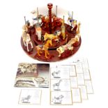 A Franklin Mint 'Magic of the Merry-Go-Round' carousel, with twelve William Manns designed