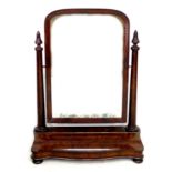 A Victorian mahogany toilet mirror, domed rectangular plate, turned supports, lift lid glove /