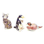 A group of three Royal Crown Derby paperweights, comprising a cat, a pheasant, and a platypus, all