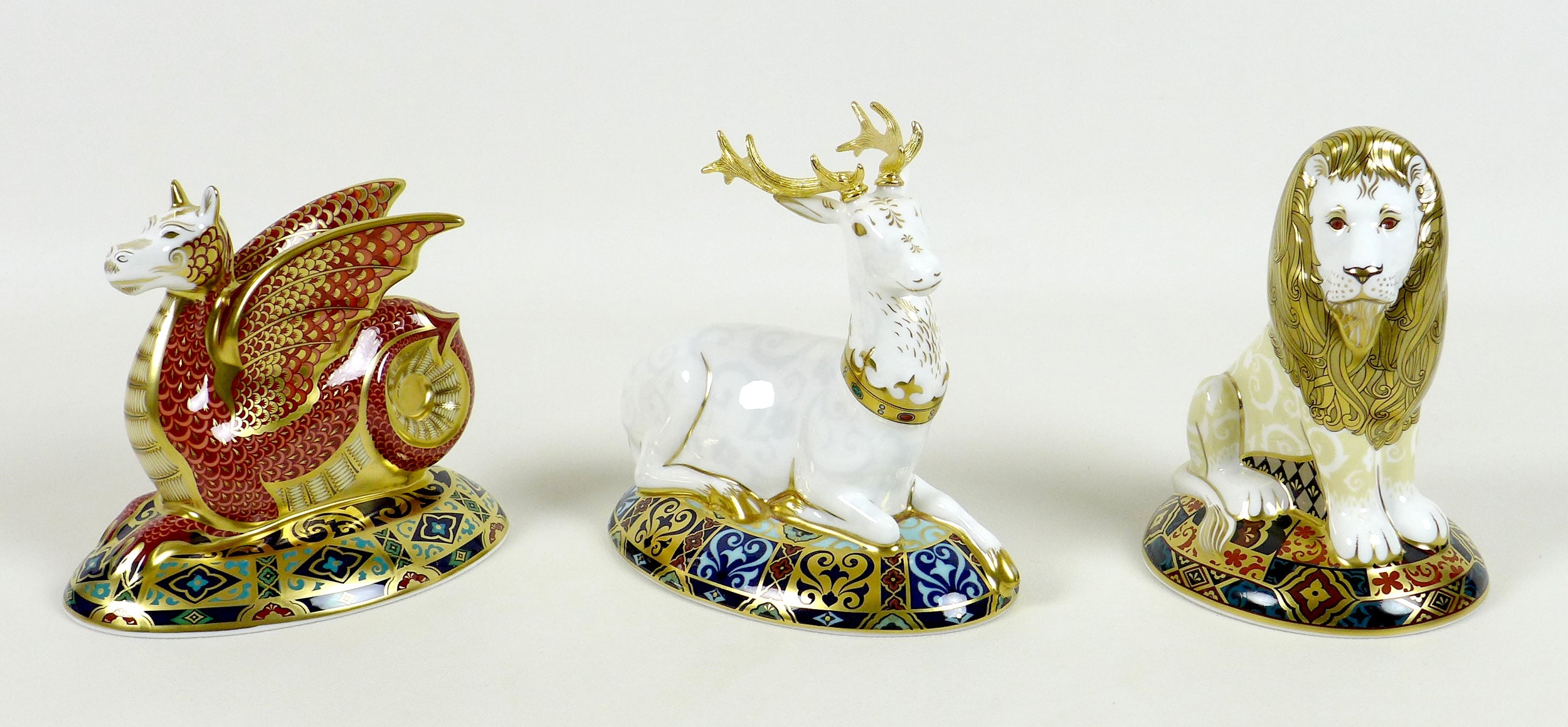 A group of three Royal Crown Derby paperweights, comprising three out of the four examples from