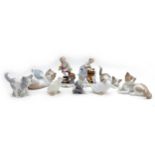 Two Rockingham style figurines together with a group of seven Lladro and Nao kittens