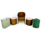 A group of wicker furniture, comprising a pair of gold painted linen baskets with pink upholstered