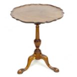 A George III mahogany occasional table, the fixed dished pie crust circular surface with moulded