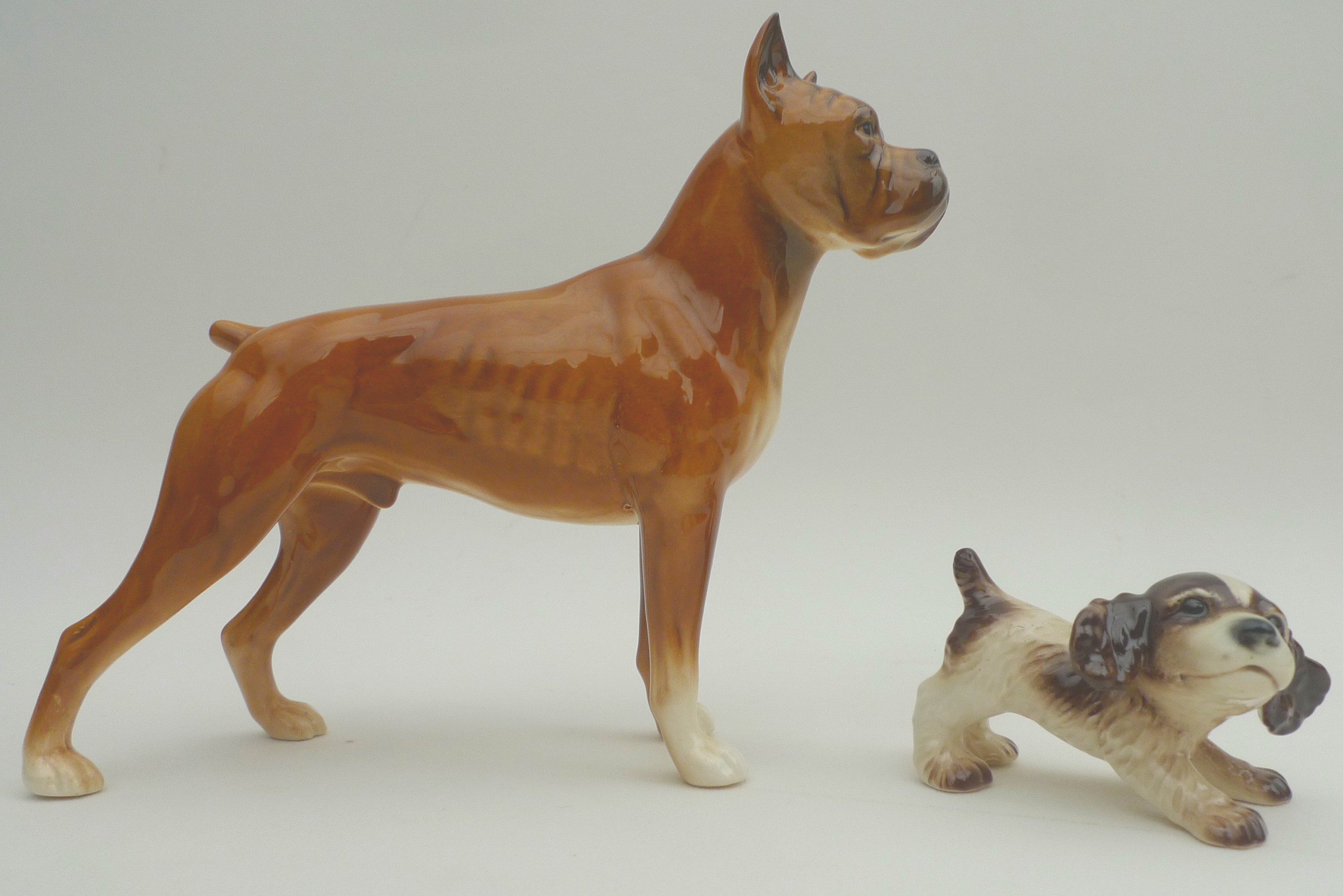 A collection of ceramic animal figurines, all modelled as dogs, some marked, including two Goebel, - Image 7 of 11