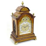 A 19th century bracket clock, by Lewis of Chichester, with domed mahogany and satinwood veneered