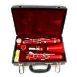 A Musical Design five piece clarinet in redA Musical Design five piece clarinet, 67cm long, with